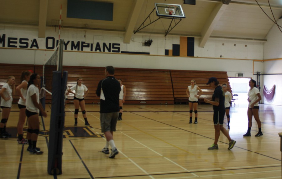 Mesa womens volleyball coach Kim Lester (right) gives her team instructions on court position during a recent practice.