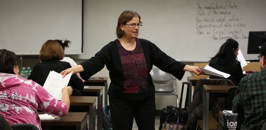 Professor Anne Winkler-Morey gives her students instructions as she hands out their midterm on March 5, 2014. Winkler-Morey teaches as an adjunct professor at Metro State University in Minneapolis. (Kyndell Harkness/Minneapolis Star Tribune/MCT)