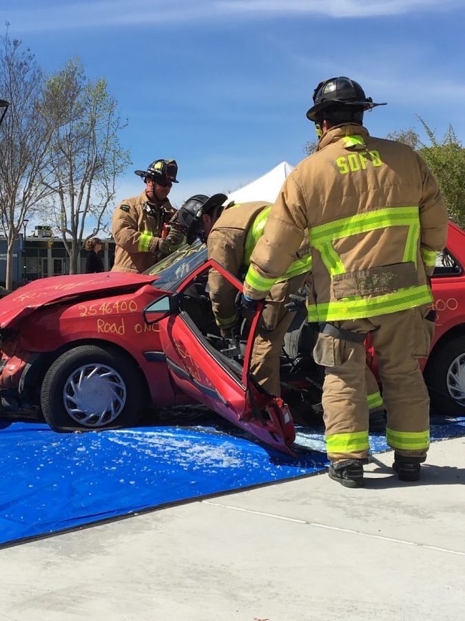 Firefighters from Station 28 in San Diego demonstrated using the Jaws of Life to rescue passengers from a wrecked vehicle