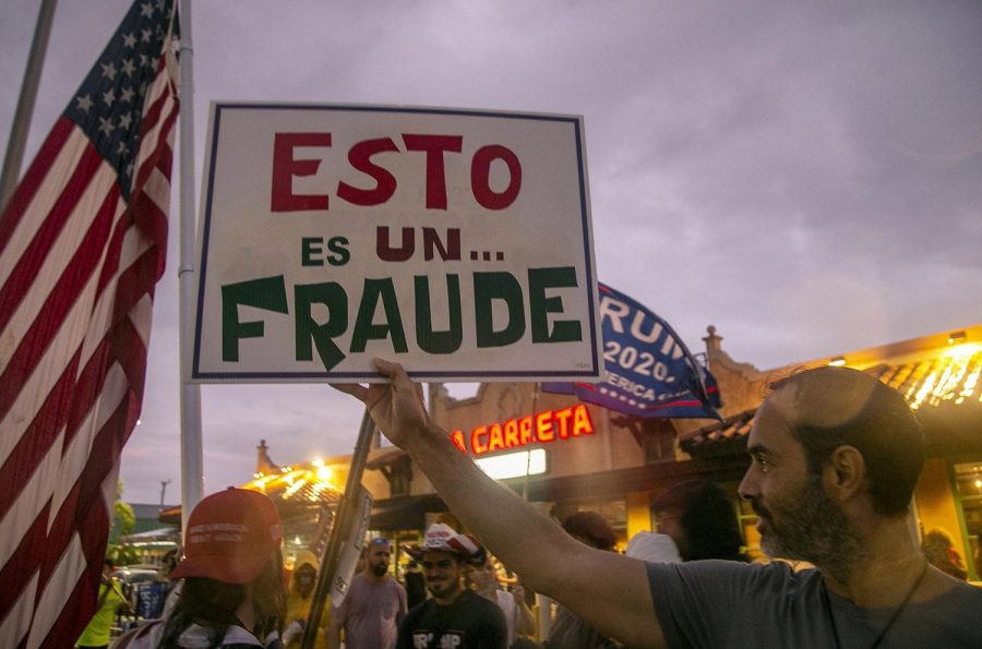 Trump-supporting Cuban-Americans rally for the president outside of a restaurant in Miami. Photo Credit: Pedro Portal/Miami Herald/TNS