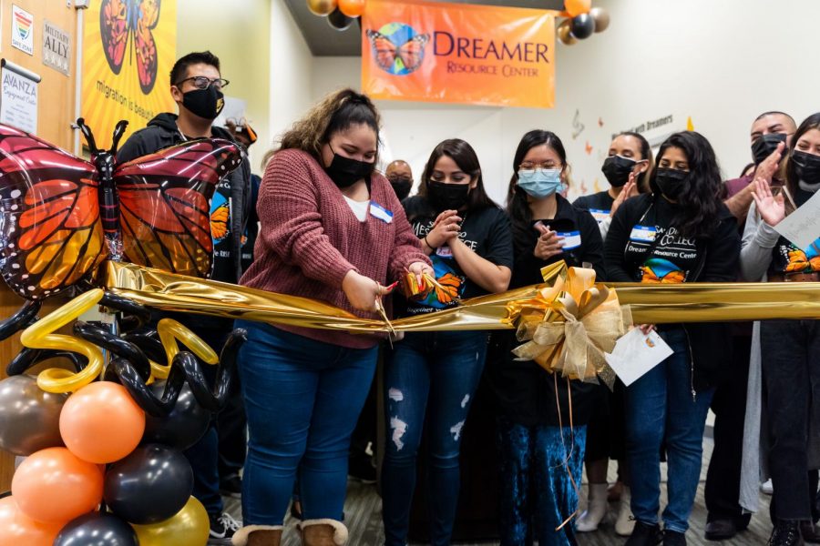 Mesa College students cut the ribbon marking the grand opening of the Dreamer Resource Center. 