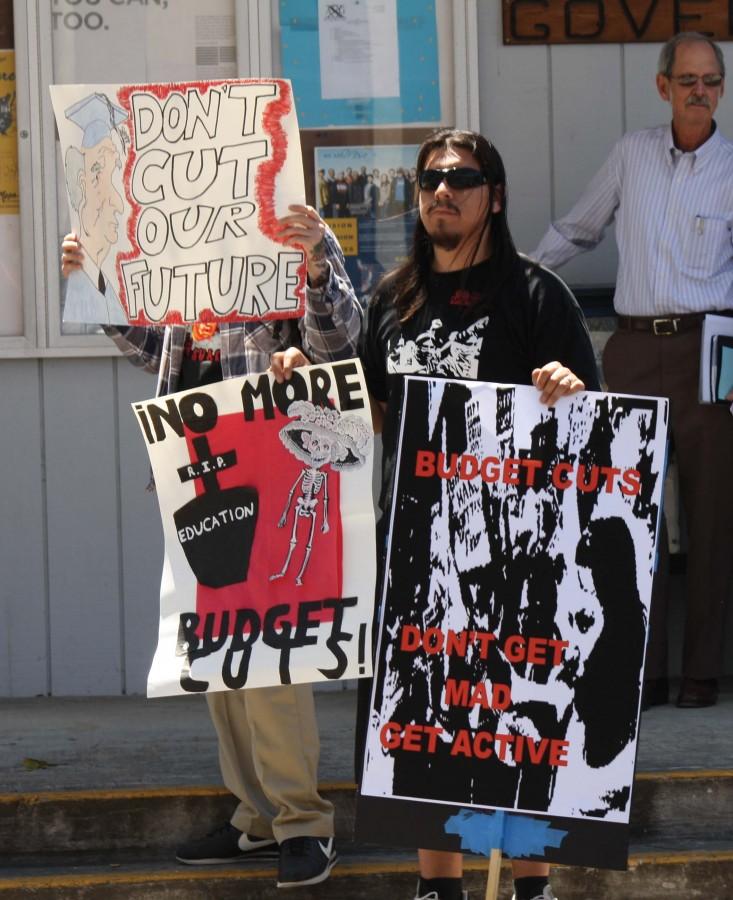 President of M.E.Ch.A, Miguel Murillo, 24, and other students brought signs to the rally to help promote action against educational budget cuts at the rally on April 27.