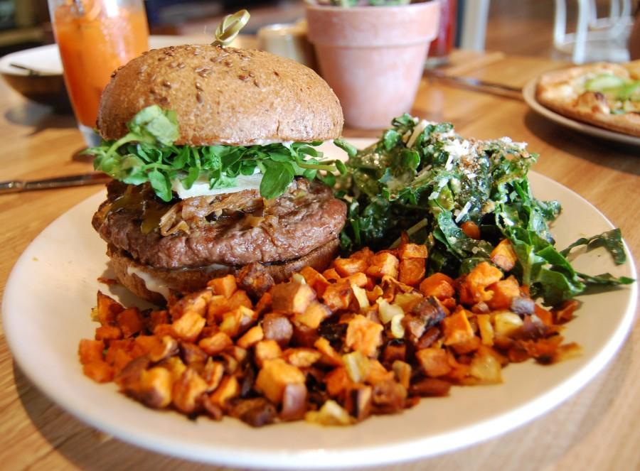 True+Food+Kitchens+robust+bison+burger+is+a+great%2C+lean+alternative+to+beef.+Served+on+a+flaxseed+bun+with+a+side+of+sweet+potato+hash+and+kale+salad%2C+this+dish+is+both+mouthwatering+and+well-balanced.+Photo+Credit%3A+Lauren+J.+Mapp%2FEditor-in-Chief