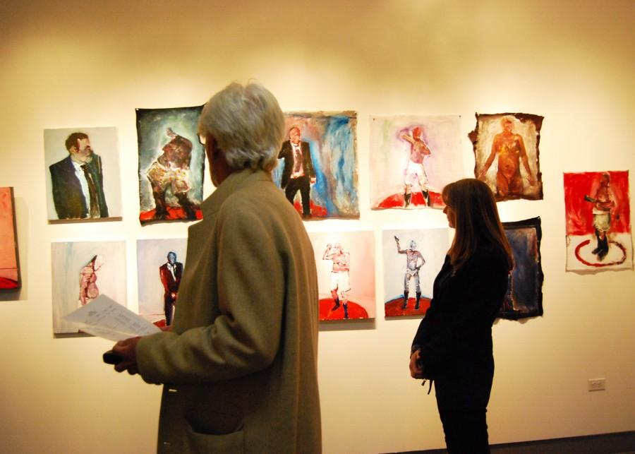 Local art patrons browse the featured works of the Dynamic Gestures exhibit at the Mesa Art Gallery.