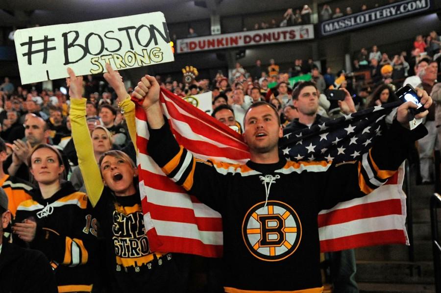 Boston+Bruins+fans+Yvonne+and+Jake+Patterson+cheer+at+the+start+of+an+NHL+game+between+the+Bruins+and+the+Buffalo+Sabers+at+TD+Garden+in+Boston%2C+Massachusetts%2C+Wednesday%2C+April+17%2C+2013.+%28Christopher+Evans%2FBoston+Herald%2FMCT%29%0A%09%09%09