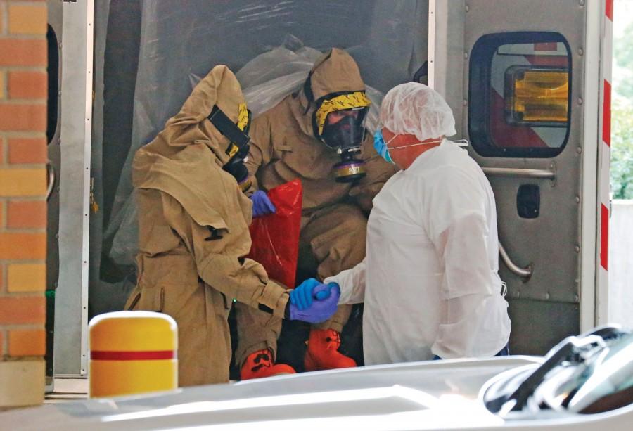 A patient transported from Frisco, Texas, with concerns of possible exposure to Ebola, arrives at the emergency room entrance of Texas Health Presbyterian Hospital in Dallas on Wednesday, Oct. 8, 2014. (Louis DeLuca/Dallas Morning News/MCT)