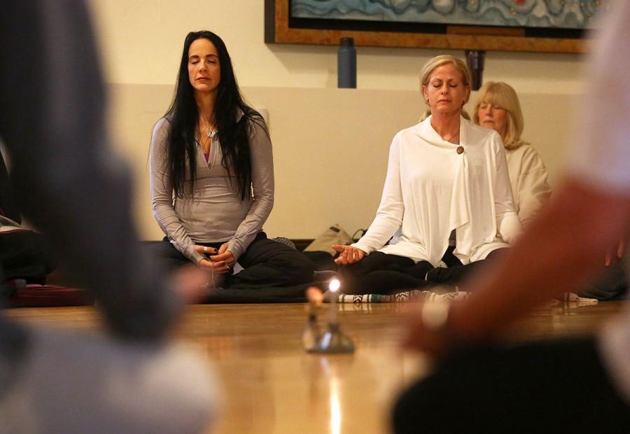 Yolanda Landow and Weezy Gardner meditate during a Midwest Moon Sangha gathering at the Wehrli Chapel on the Webster Groves campus in St. Louis on Saturday, Oct. 3, 2015. The meditation session was followed by a quiet walking portion and concluded with second portion of sitting. (Roberto Rodriguez/St. Louis Post-Dispatch/TNS)