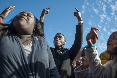 Student protesters at Missouri University celebrate after president of university, Tim Wolfe, resigned.