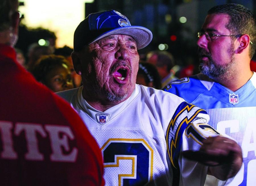 San Diego Chargers fan Jesse Constancio, a season ticket holder for 22 years, speaks to television cameras as he and other fans enter Spreckles Theater for a town hall meeting with NFL representatives to discuss the future of the Chargers in San Diego on Wednesday, Oct. 28, 2015. 