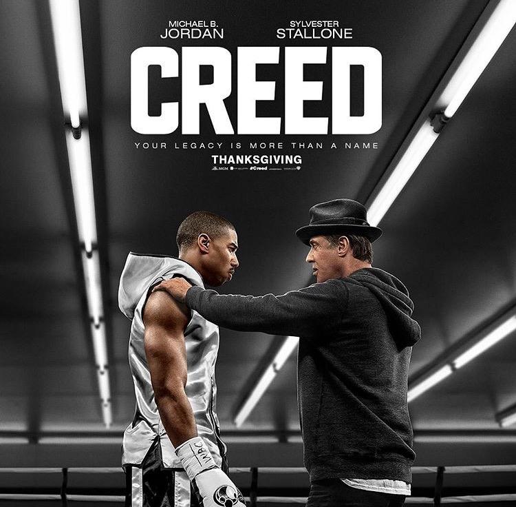 Adonis Creed (Michael B. Jordan) and Rocky Balboa (Sylvester Stallone) stand in the boxing ring in preparation for Creeds big fight.
