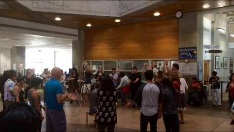 San Diego Mesa College's Vocal Ensemble performs a short piece in the Learning Resource Center