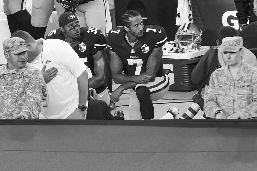 San Francisco 49ers quarterback Colin Kaepernick (7) and Eric Reid (35) kneel down during the playing of the national anthem before their NFL game on Monday, Sept. 12, 2016 at Levi's Stadium in Santa Clara, Calif. (Jose Carlos Fajardo/Bay Area News Group/TNS)