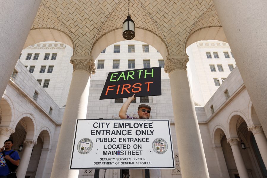 Juan Ramirez proclaims, Earth First, in front of City Hall at the end of the March for Science in Los Angeles on Saturday, April 22, 2017. (Genaro Molina/Los Angeles Times/TNS)