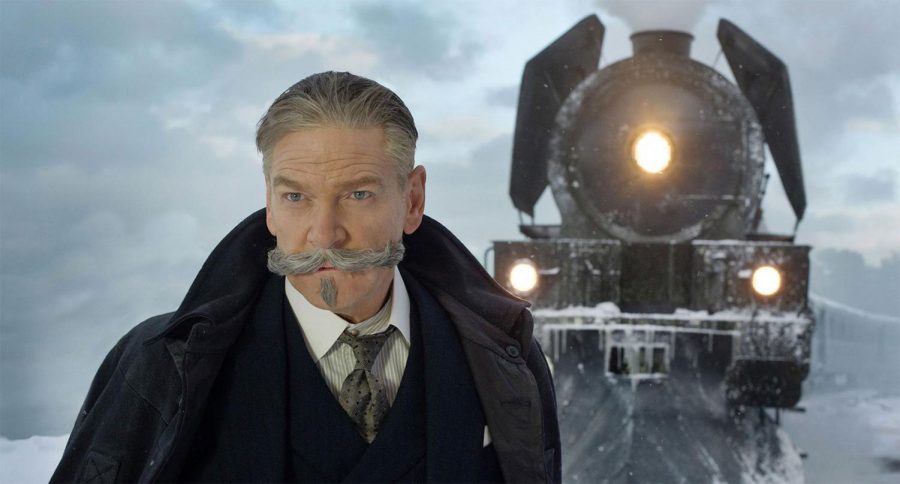 Kenneth Branagh as detective Hercule Poirot in front of the Orient Express