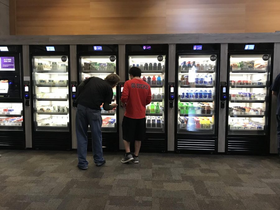 Students buying products from the new Smart Market system in the LRC.