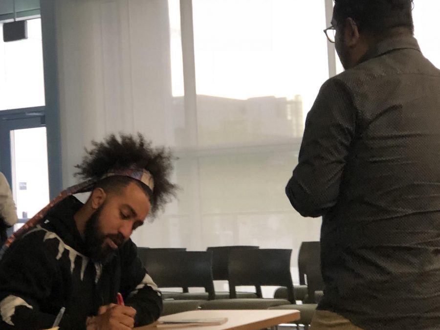 Jeremy Michael Vasquez holds a signing for his book, Unshackled after the event. Photo Credit: KC Portee