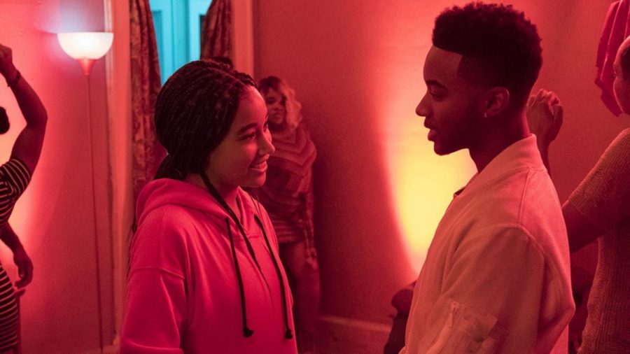 Starr (Amandla Stenberg) and Khalil (Algee Smith) reconnect at a party in their neighborhood. 