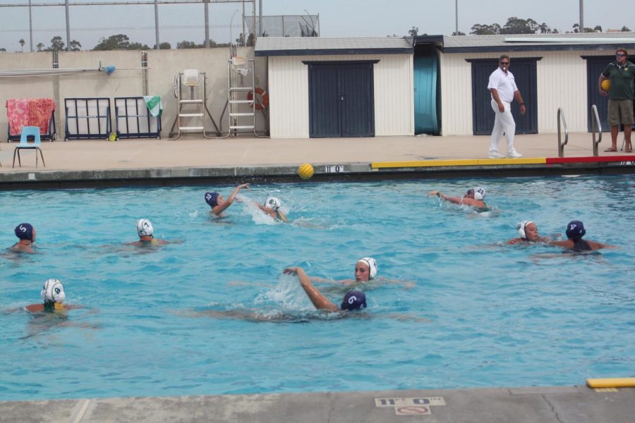 Attacker Ashley Green passes ball to teammate.