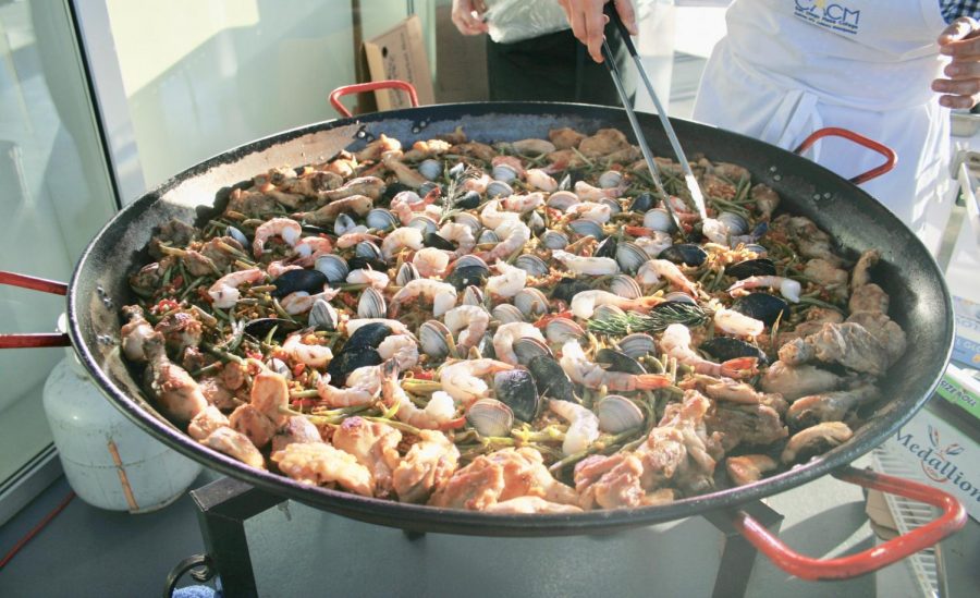 The paella is ready when all of the clams and mussels shells are open
