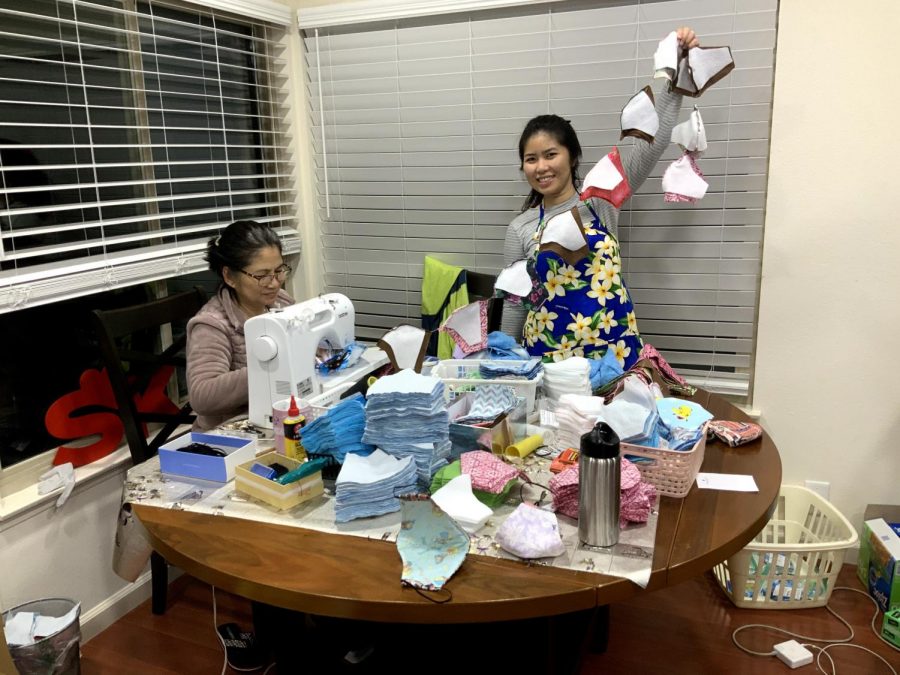 Hoang Nguyen and daughter Khanh Huynh have turned their dining room into a production facility for face masks, topping 2,000 pieces. 