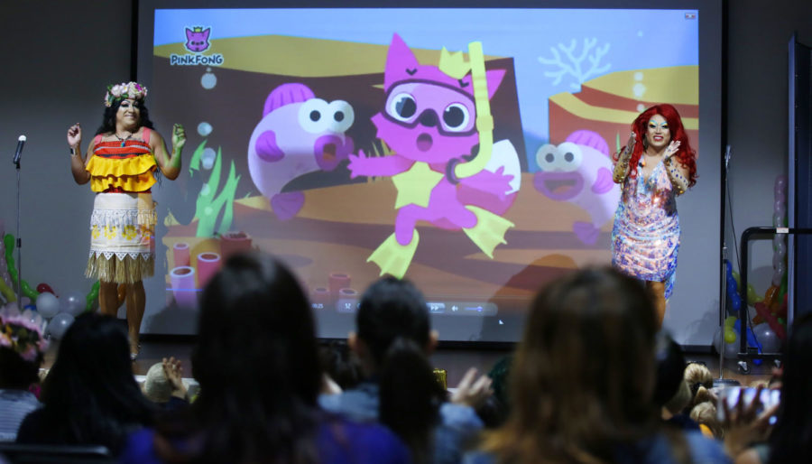 Barbie Q, left, and Raquelita, right, sing the song Baby Shark during Drag Queen Story Time at the Chula Vista Civic Center Library on Sept. 10, 2019.