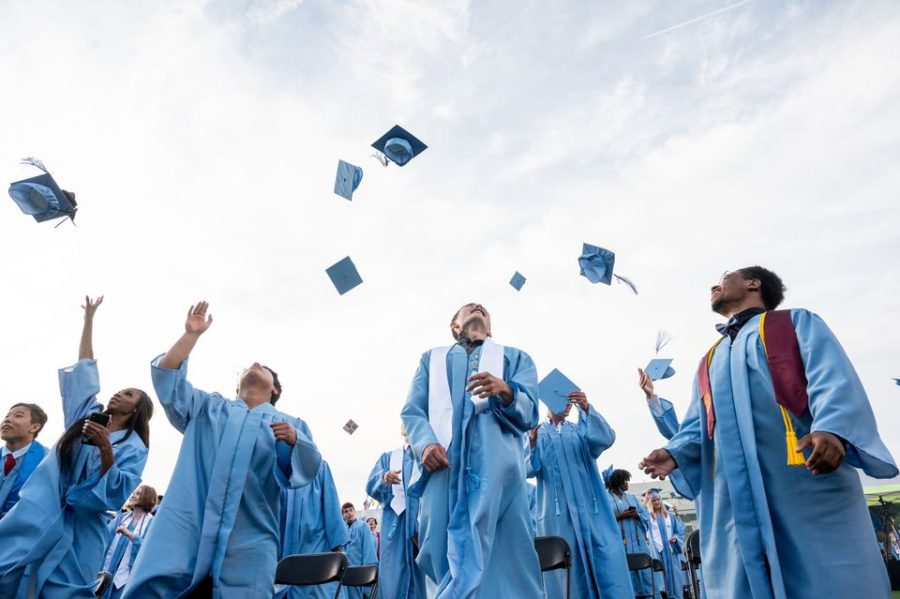Graduates toss their caps during Skyline's Class of 2021 commencement.