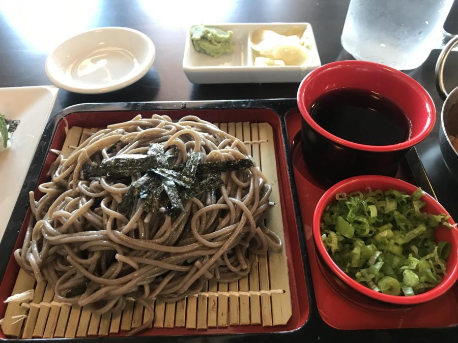 Cold+Soba+Noodles+served+on+a+bamboo+sheet+with+a+side+of+green+onions+and+dipping+sauce.