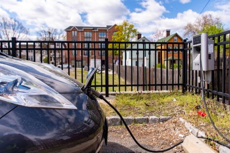 A Nissan Leaf electric vehicle uses a car charging station in South Orange on Thursday, April 22. 2021