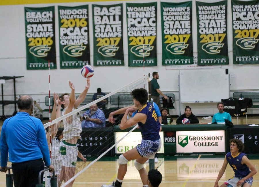 Ricardo Lorja secures a kill during the second set against the Griffins. Photo Credit: Andres Armenta/The Mesa Press.