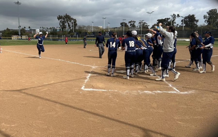 Cierra+Filippone+is+greeted+by+her+teammates+after+extending+Mesas+lead+in+game+two+with+a+solo+home+run.+Photo+Credit%3A+Clay+Fordham%2FThe+Mesa+Press.