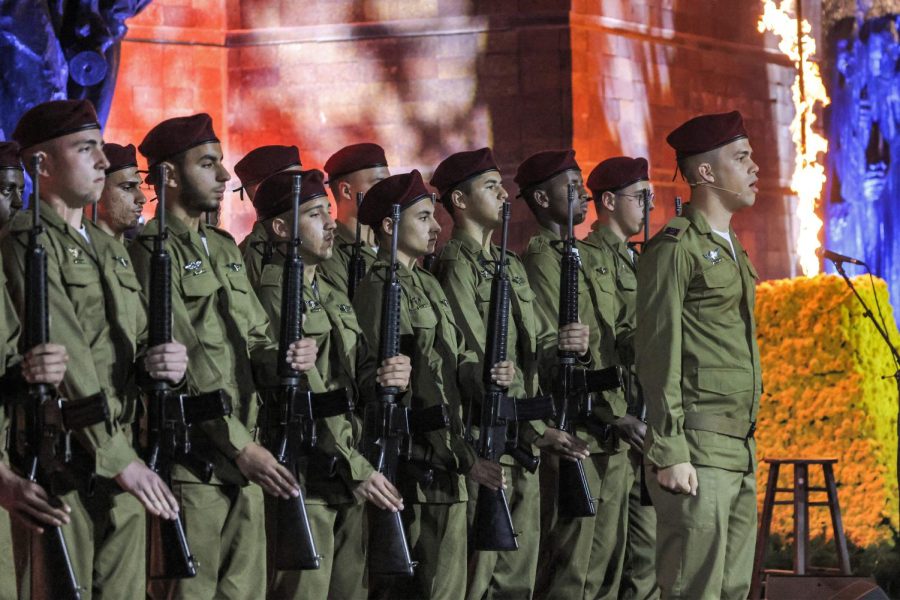 Israeli+soldiers+stand+on+stage+during+a+ceremony+marking+Yom+HaShoah%2C+Holocaust+Remembrance+Day%2C+for+the+6+million+Jews+killed+during+World+War+II%2C+at+the+Yad+Vashem+Holocaust+Memorial+in+Jerusalem+on+April+17%2C+2023.+%28Menahem+Kahana%2FAFP%2FGetty+Images%2FTNS%29