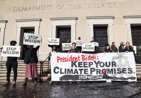 Climate activists hold a demonstration to urge President Joe Biden to reject the Willow Project at the U.S. Department of the Interior on Nov. 17, 2022, in Washington, D.C. Biden approved the project this month.