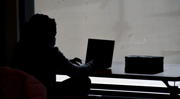 A student sits before a computer screen in the Safe Center for Online Learning, a program run by The YMCA in Central Maryland.

