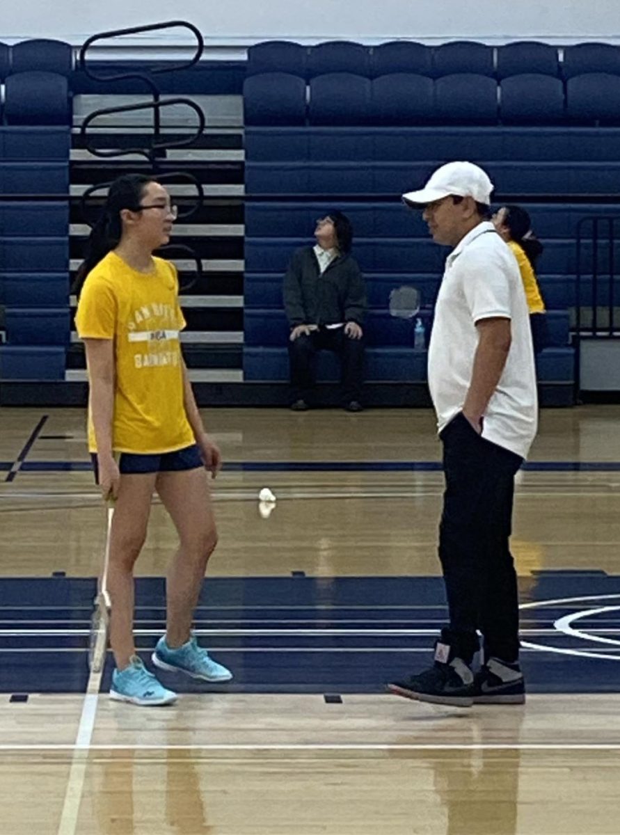 Assistant Coach Thai Lay discusses shot selections with Megan Nguyen on March 14, 2024.