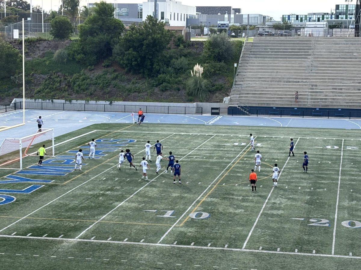 Olympians kicking a corner kick.