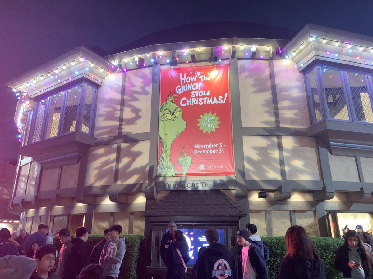 Theater attendees gather in front of the Old Globe Theatre in San Diego before a showing of "Dr. Seuss’s How the Grinch Stole Christmas!” on Nov. 6, 2025 